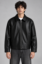 Black faux leather jacket by XOVRA featuring a premium streetwear design and sleek front fit.