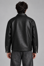 Premium black faux leather jacket with detailed zipper design for a bold streetwear look by XOVRA.