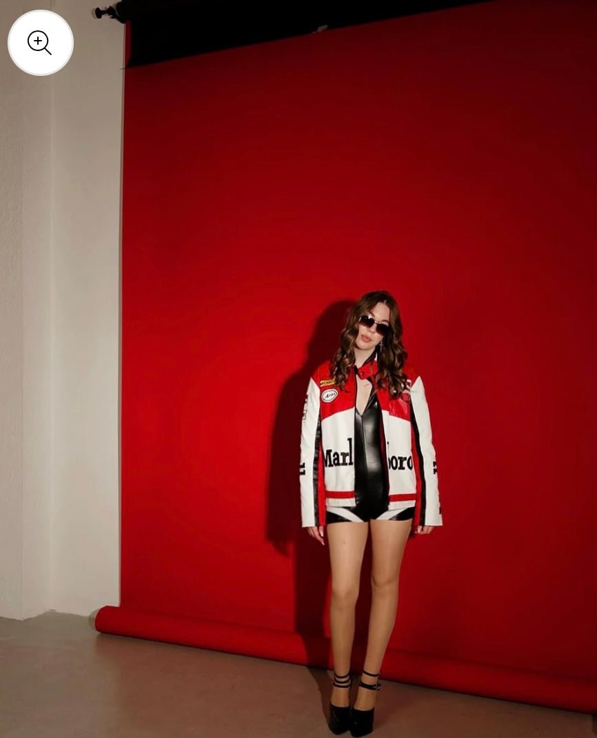 Female Indian model posing in white and red racing jacket — XOVRA premium urban fashion India.
