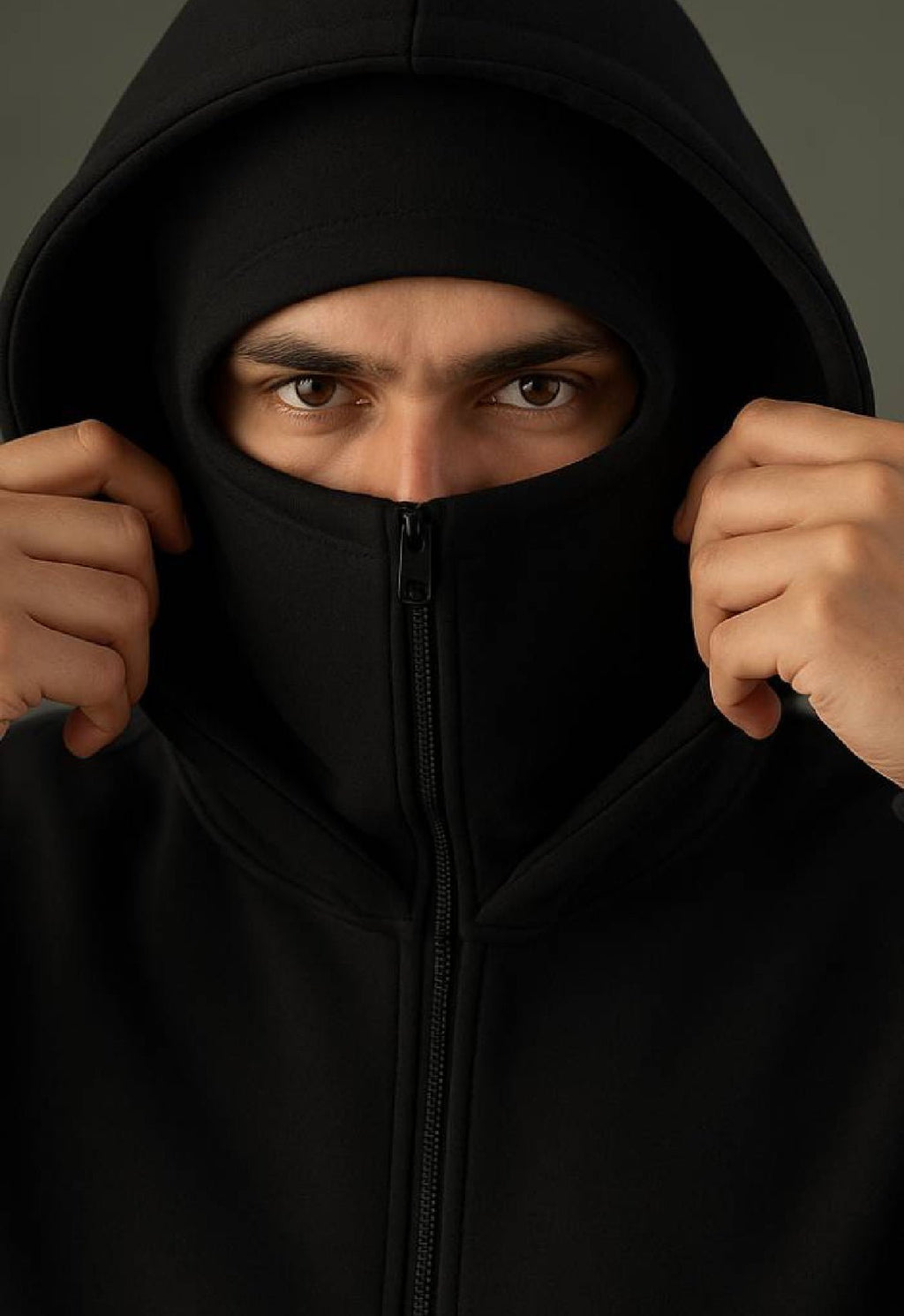 Model wearing XOVRA Balaclava Zipper Hoodie with full-zip face cover – black oversized streetwear