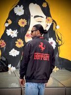 Indian model posing in black Ferrari F1 jacket outdoors – XOVRA premium streetwear