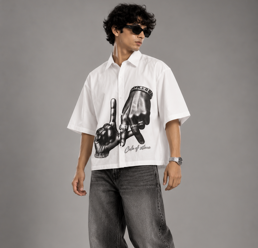 XOVRA white graphic shirt for men styled with wide-leg jeans